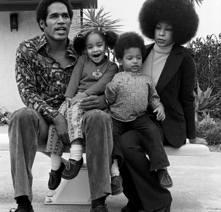 Picture of Aaren Simpson with her father, mother and elder sibling posing for a group photo.